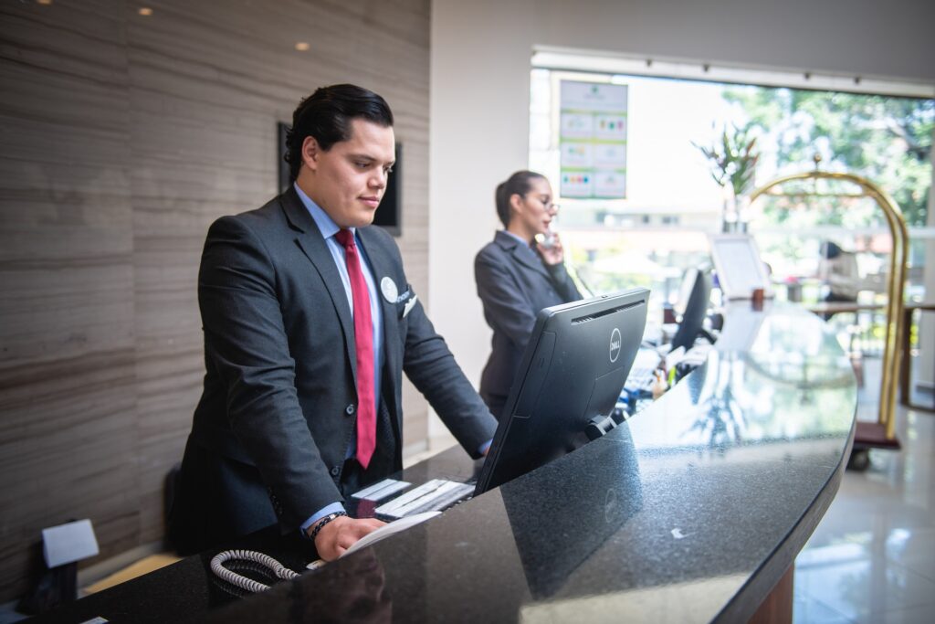 Two hotel front desk agents